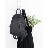 Osgoode Marley teardrop-shaped multi-zip backpack with multiple compartments and adjustable straps, designed for casual carrying.
