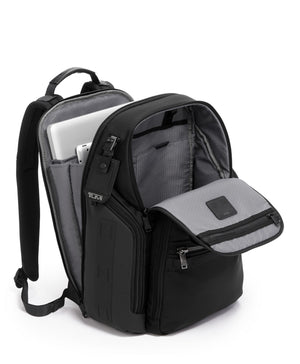 Tumi Alpha Bravo Search backpack with multiple compartments and padded shoulder straps, black nylon fabric, front zipper pockets.