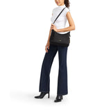 Tumi Voyageur Asbury shoulder bag in durable fabric with adjustable strap and multiple compartments, stylish crossbody design.