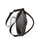 Tumi Voyageur Asbury shoulder bag with adjustable crossbody strap, featuring stylish design and multiple compartments.