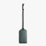 Bellroy luggage tag in a slim leather design with a secure strap and address window