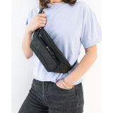 Black Osgoode Marley RFID organizer waistpack with multiple compartments and adjustable strap, designed for secure storage and travel.
