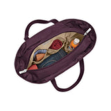 Briggs & Riley Baseline traveler tote bag in black, showing top handles, spacious interior, and durable fabric for travel and daily use.