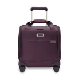 Briggs & Riley Baseline cabin spinner carry-on luggage in blue with four wheels and retractable handle for easy travel.