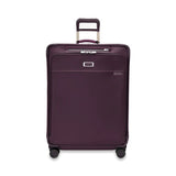 Briggs & Riley Baseline large expandable spinner checked luggage with blue hard shell and four spinner wheels.