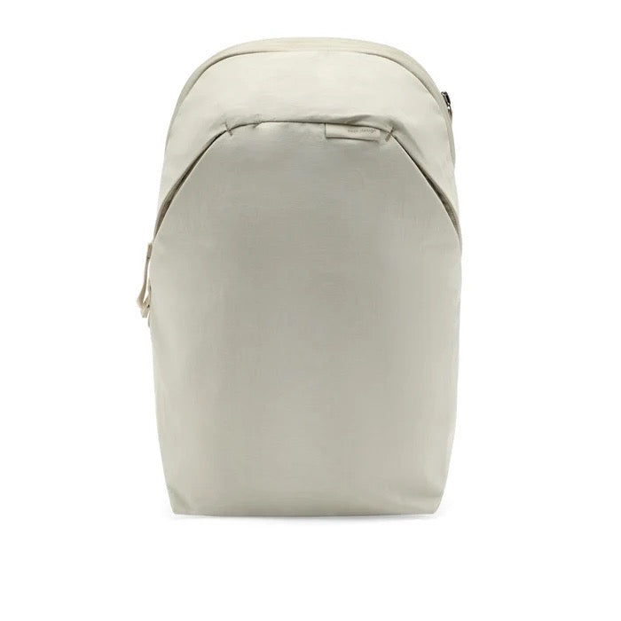 Peak Design City Backpack 15L in Moon color, featuring a sleek design, top handle, and adjustable straps for everyday use.