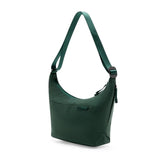 Peak Design City Crescent 6L Cypress travel bag showing compact design with adjustable straps and spacious interior.