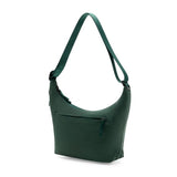 Peak Design City Crescent 6L bag in Cypress color with front zip pockets and adjustable strap, designed for everyday carry.