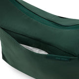 Peak Design City Crescent 6L camera bag in Cypress color, showing compact design with adjustable straps and front pocket.