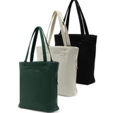 Peak Design City Tote in black with spacious main compartment, leather handles, and sleek modern design for everyday carry.