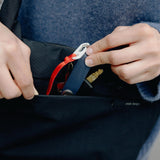 Peak Design City Crescent 6L compact travel bag shown in a lifestyle setting with multiple compartments and sleek design.