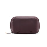 Peak Design Tech Pouch with multiple compartments, black fabric, zipper closure, designed for organizing tech accessories.