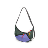 Topo Designs Moonlight Crossbody Bag in dark fabric with adjustable strap and front pocket, showcasing its compact, stylish design.