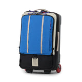 Topo Designs Global Travel Bag roller, carry-on luggage with durable black fabric, multiple compartments, and adjustable handle.