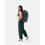 Matador 30L Carry On Travel Pack in juniper green, shown with multiple compartments and durable fabric for travel durability.