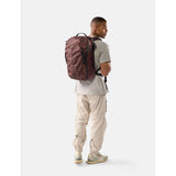 Matador 30L Carry On Travel Pack in garnet color, featuring durable fabric and compact design for easy travel and packing.