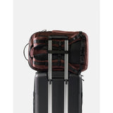 Matador 30L Carry On Travel Pack in garnet color, compact and lightweight with multiple compartments for travel convenience