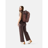 Matador 30L Carry On Travel Pack in garnet color, showing compact design with adjustable straps and durable fabric.