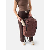 Matador 30L Carry On Travel Pack in garnet, featuring durable fabric, compact design, and adjustable straps for travel convenience.