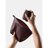 Matador FlatPak™ Toiletry Case V2 waterproof accessory with compact, durable design, shown in a red color with zipper closure.