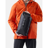 Matador Flatpak 8L dry bag in black with roll-top closure and adjustable strap for waterproof storage on outdoor trips.