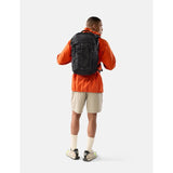 Matador 24L Adventure Pack in black with adjustable straps, multiple compartments, and durable fabric for outdoor travel.