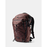 Matador 24L Adventure Pack in garnet with compact design, durable fabric, and adjustable straps for outdoor travel and hiking.