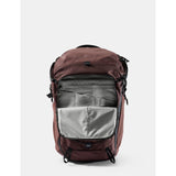 Matador 24L Adventure Pack in garnet color with multiple compartments and durable material, designed for outdoor adventures.