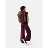 Matador 24L Adventure Pack in garnet with multiple compartments, made from durable waterproof material.