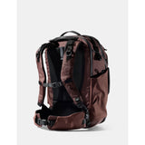 Matador 35L Global Travel Pack in garnet, showing compact design with multiple compartments and adjustable straps for travel.