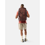 Matador 45L Global Travel Pack in garnet color with adjustable straps and compact design, suitable for travel and outdoor adventures.