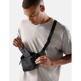 Matador 2L Lite Sling in black, compact waterproof shoulder bag with adjustable strap for outdoor activities and everyday use.