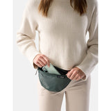 Matador 2L Lite Sling made of durable material in juniper green, compact and lightweight for outdoor adventures.