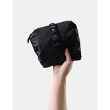 Black Matador 30L packable duffel bag with compact design and sturdy handles, ideal for travel and storage.