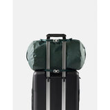 Matador 30L packable duffel bag in juniper green, shown folded and expanded, lightweight and compact for travel or gym use.