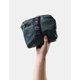 Matador 30L packable duffel bag in juniper green, lightweight and compact, shown folded and partially unrolled.