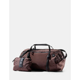 Red Matador 30L packable duffel bag folded open, showing durable fabric and compact design for travel and storage.