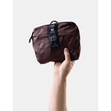 Matador 30L packable duffel bag in garnet red, lightweight and foldable for travel or gym use.