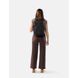 Matador 18L black personal item travel pack with compact design and durable material, suitable for carry-on travel essentials.