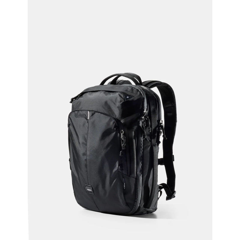 Matador 18L personal item travel pack in black with compact design and top zipper closure, suitable for carry-on travel.