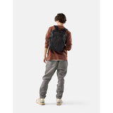 Matador 18L black personal item travel pack with compact design and multiple compartments for organized packing.