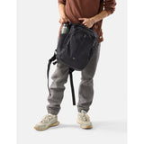 Matador 18L black personal item travel pack with compact, lightweight design and multiple compartments for organized travel.
