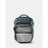 Matador 18L personal item travel pack in juniper green with compact design and multiple compartments for organized travel storage.