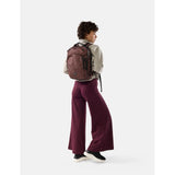Matador 18L personal item travel pack in garnet color, compact backpack with multiple compartments for travel essentials.