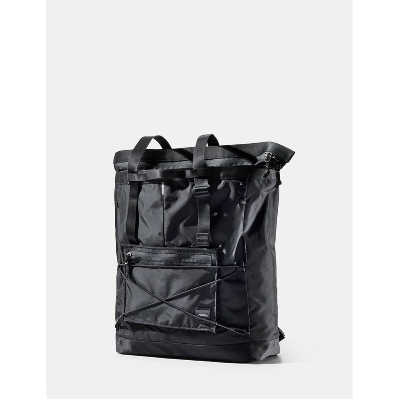Matador 24L Tote Pack in black, showing a compact, lightweight waterproof tote bag with shoulder straps and sleek design.