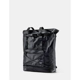 Matador 24L Tote Pack in black, showing a compact, lightweight waterproof tote bag with shoulder straps and sleek design.