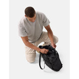 Black Matador 24L Tote Pack with adjustable straps and spacious main compartment, designed for versatile carrying and storage.