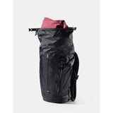Matador 18L waterproof packable backpack in black, shown folded and unfolded, lightweight outdoor gear for travel and hiking.