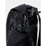 Matador 18L waterproof packable backpack in black, shown folded and unfolded, designed for lightweight, durable outdoor use.