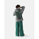 Matador 18L waterproof packable backpack in juniper green, showing lightweight, foldable design with adjustable straps.